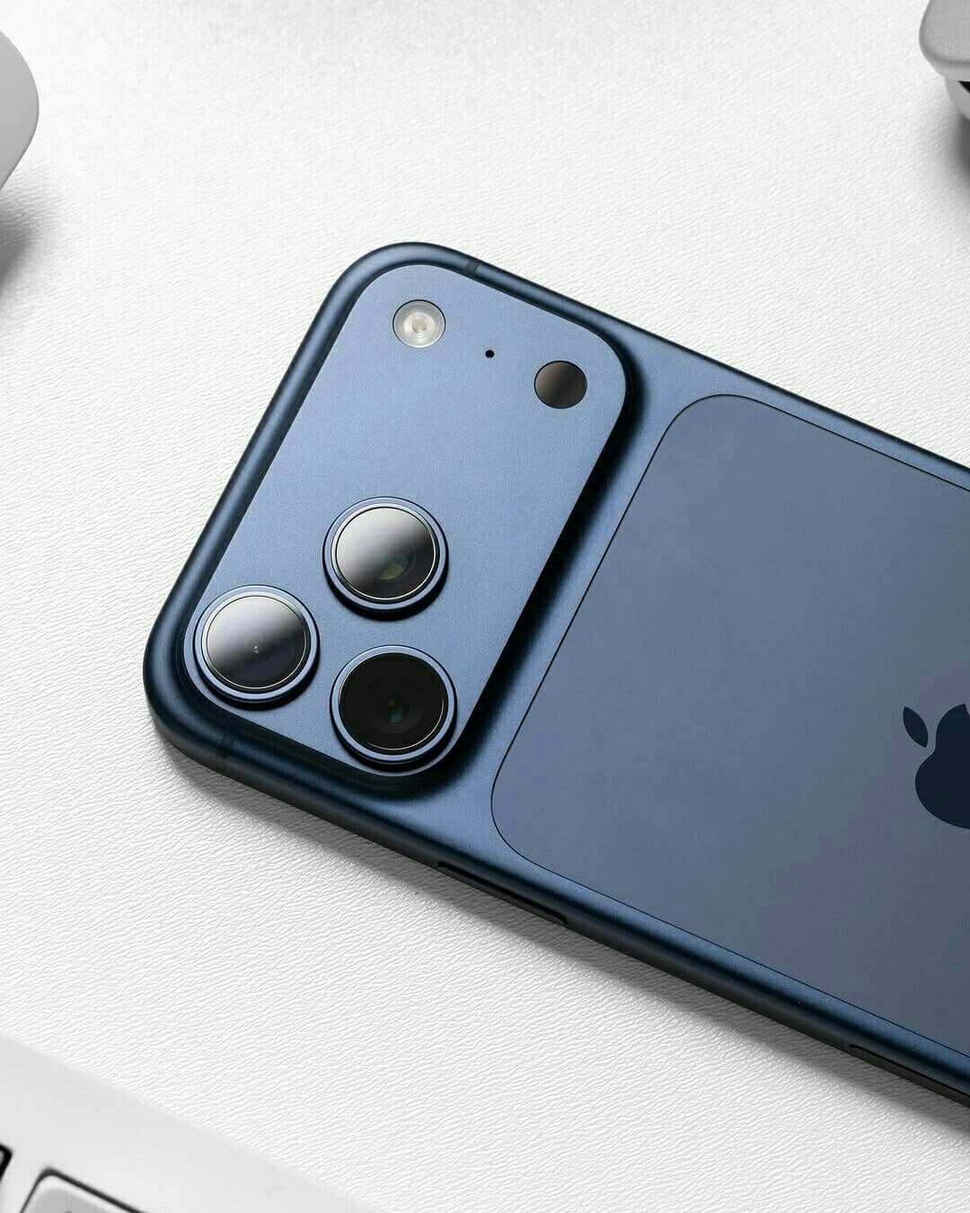 Close-up of an iPhone Pro camera system in a deep blue finish