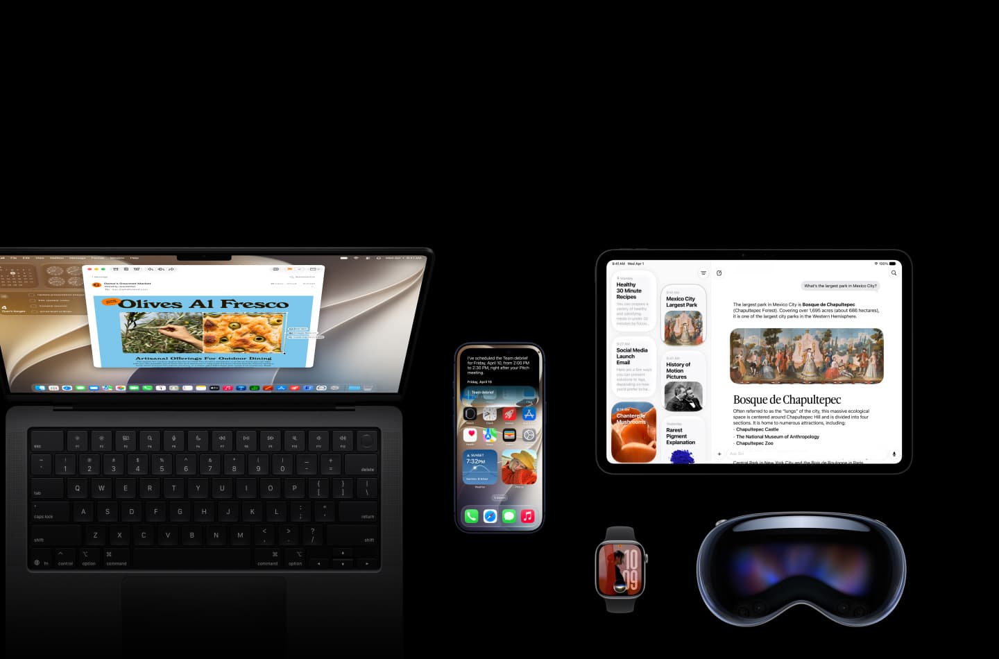 A MacBook, iPhone, iPad, Apple Watch and Apple Vision Pro arranged together